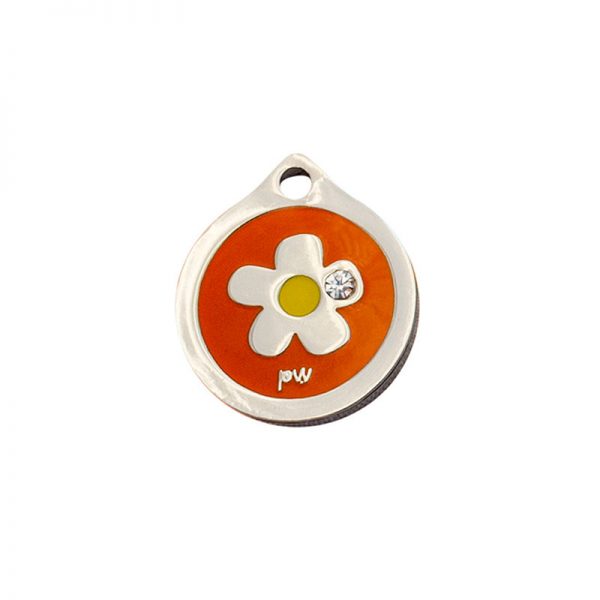 Placa identificativa con una flor y un diamante sobre fondo naranja