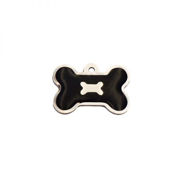 Placa para perros con forma de hueso y un hueso sobre fondo negro.
